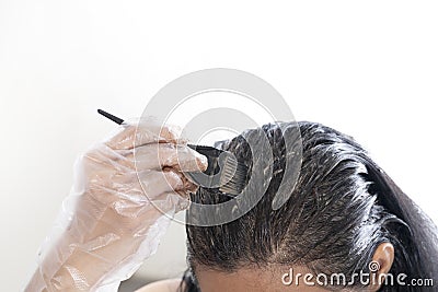 Woman dyeing her hair at home Stock Photo