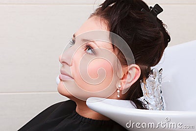 Woman dying hair in hairdressing beauty salon. Hairstyle. Stock Photo