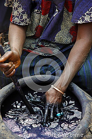 Woman dying material indigo Stock Photo