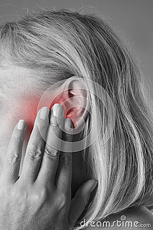 Woman with earache, ear pain closeup Stock Photo