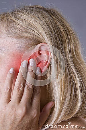 Woman with earache, ear pain closeup Stock Photo