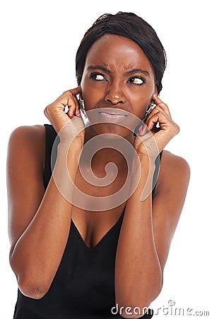 Woman, ears and studio annoyed or noise listening, tired or frustrated frown. Black model person, confused face and Stock Photo