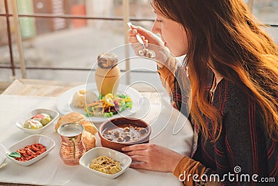 Woman eat turkish food from meatball and pottery kebab Stock Photo