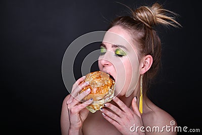 Woman eating big hamburger Stock Photo