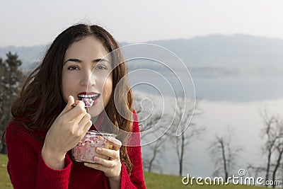 Woman eating breakfast Stock Photo