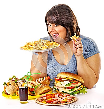 Woman eating fast food. Stock Photo