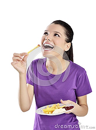 Woman eating french fries. Stock Photo