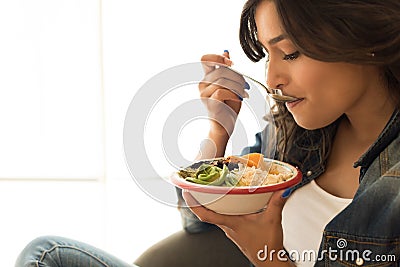 Woman eating a healthy bowl Stock Photo