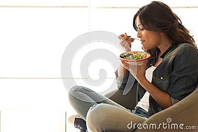 Woman eating a healthy bowl Stock Photo