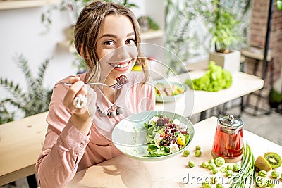 Woman eating healthy green food Stock Photo