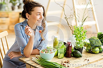 Woman eating healthy salad Stock Photo