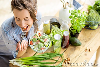 Woman eating healthy salad Stock Photo