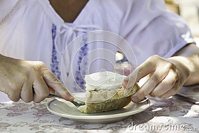 Woman eating lemon pie Stock Photo