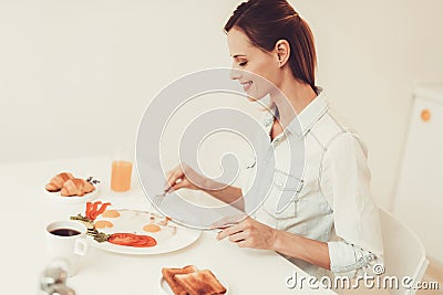 Woman Is Eating An Omelette. Breakfast Concept. Stock Photo