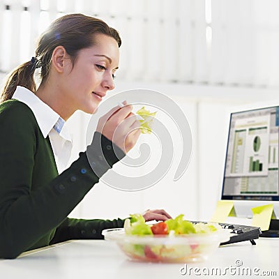 Woman eating salad Stock Photo