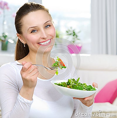 Woman Eating Salad Stock Photo