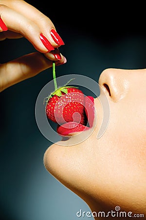 Woman Eating Strawberry Stock Photo