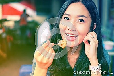 Woman eating Chinese steamed dumpling Stock Photo