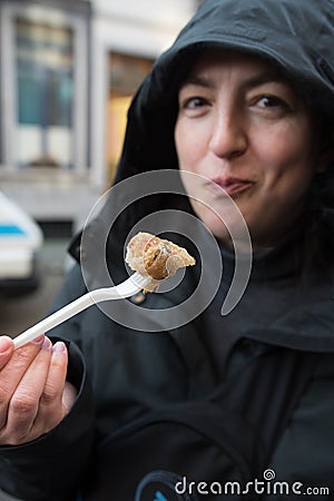 Woman eating Thai spring rolls Stock Photo