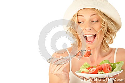 Woman eating vegetable salad Stock Photo