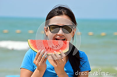 Woman Eating Watermelon Stock Photo