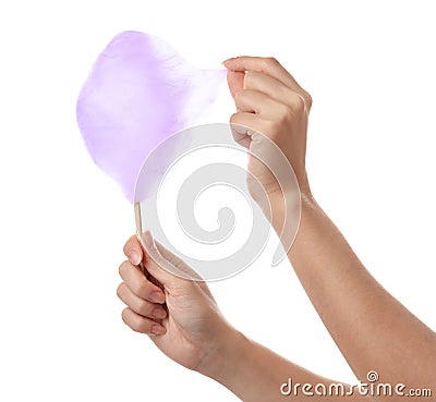 Woman eating yummy cotton candy on white background Stock Photo