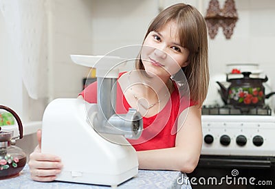 Woman with electric mincer Stock Photo