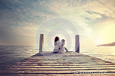 Woman embracing sweetly his dog while looking the view Stock Photo