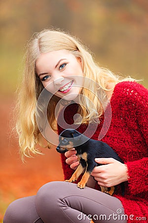 Woman embrancing her puppy dog Stock Photo