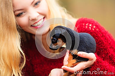 Woman embrancing her puppy dog Stock Photo