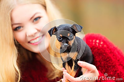 Woman embrancing her puppy dog Stock Photo