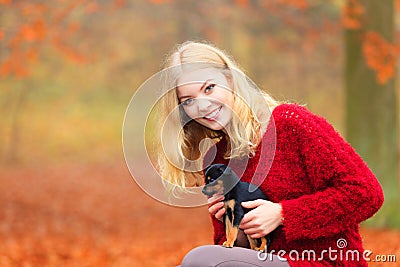 Woman embrancing her puppy dog Stock Photo