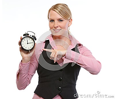 Woman employee pointing on alarm clock Stock Photo