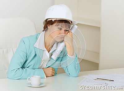 Woman engineer sits on workplace at office Stock Photo