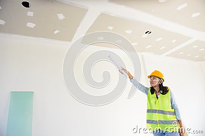 Woman engineers working in side building planning for the ceiling Stock Photo