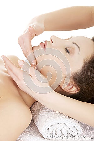 Woman enjoy receiving face massage Stock Photo