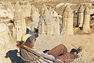 Woman enjoying amazing view of `Valley of Love` in Cappadocia Stock Photo
