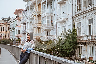 woman enjoying the beauty of building in arnavutkoy Stock Photo