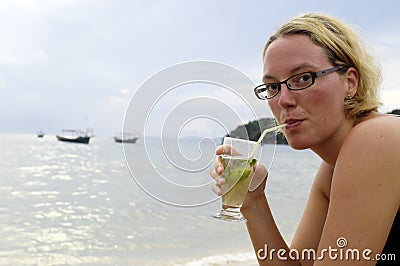 Woman enjoying a cocktail Stock Photo