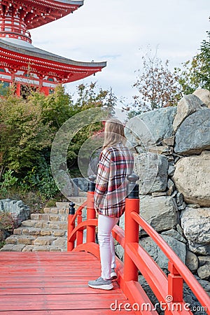 Woman enjoying nature walking in Japanese Garden Stock Photo