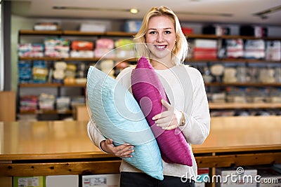 Woman enjoying purchased home textiles Stock Photo