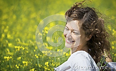 Woman enjoying in rapeseed field Stock Photo