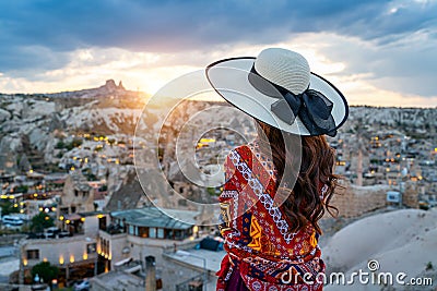 Woman enjoying view of Goreme town, Cappadocia in Turkey. Stock Photo