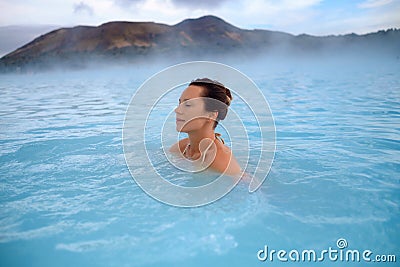 Woman enjoys spa in geothermal hot spring Stock Photo