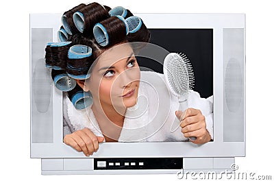 Woman escaping from television Stock Photo