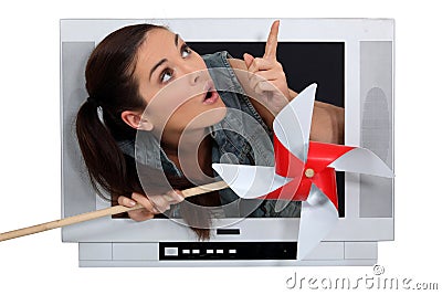 Woman escaping from a television Stock Photo