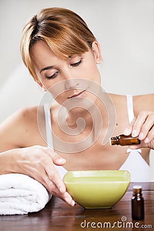 Woman with essential oils Stock Photo