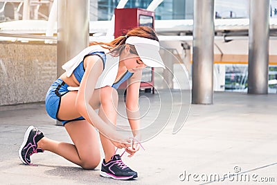 Woman is exercising in the city Stock Photo