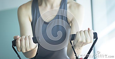 Woman exercising exercise bands Stock Photo