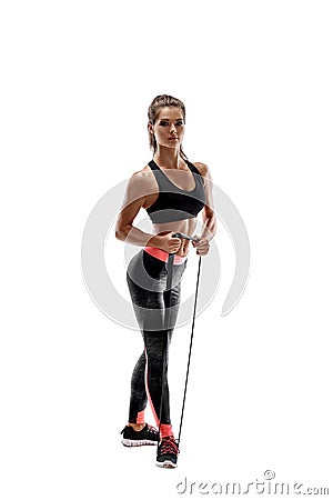 Woman exercising fitness resistance bands in studio silhouette isolated on white background Stock Photo